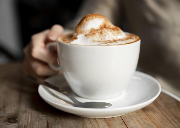 close-up-woman-serving-cop-coffee