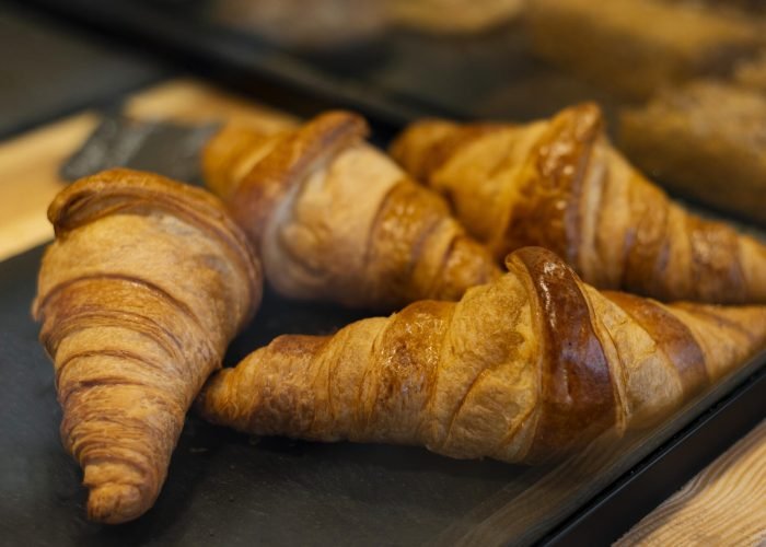 high-angle-delicious-croissants-tray